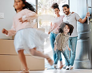 Happy, moving and parents with children running in their new modern family house with excitement. Happiness, smile and