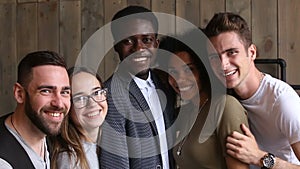 Happy multi-ethnic young people bonding posing for group portrait photo