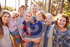 Happy multi-generation family portrait in the countryside