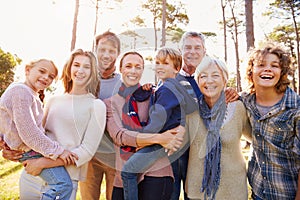 Happy multi-generation family portrait in the countryside