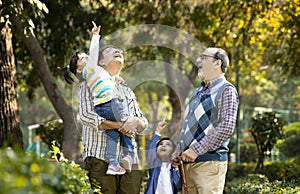 Happy multi generation Indian family at park outdoor