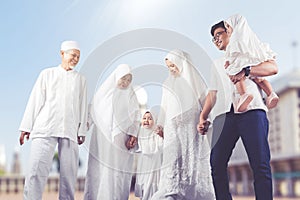 Happy multi-generation muslim family shot outdoor photo