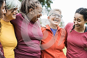 Happy multi generational women having fun together after sport workout outdoor - Focus on right woman face