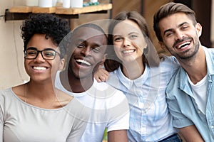 Happy multicultural friends group laughing looking at camera, portrait