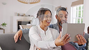 Happy multiethnic couple doing video call