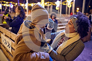 Happy multiethnic couple enjoying in the winter night