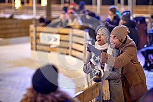 Happy multiethnic couple exploring the city; Holiday joy concept