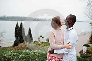 Happy multiethnic couple in love story. Relationships of african man and white european woman
