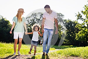 Happy multiethnic family having fun together outdoors. People love happiness concept