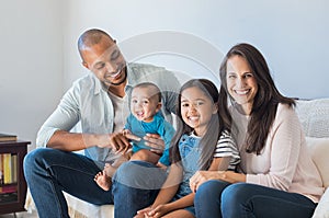 Happy multiethnic family on sofa