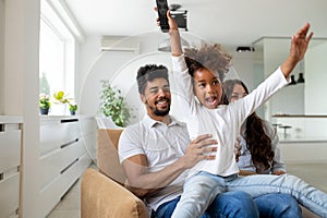 Happy multiethnic family spending time together at home.