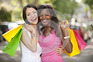 Happy multiethnic friends shopping photo