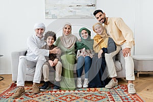 happy multiethnic muslim family looking at