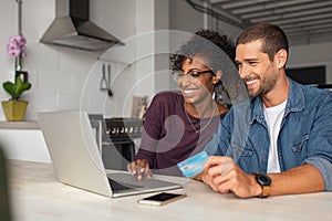 Happy multiethnic ouple making online payment