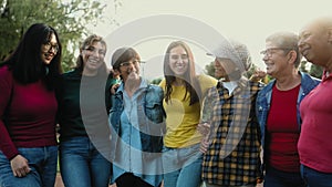 Happy multigenerational group of women with different ethnicities having fun in a public park