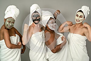 Happy multiracial females with different age and body size having skin care spa day