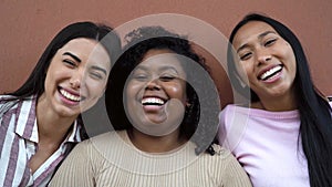 Happy multiracial friends having fun laughing in front of video camera