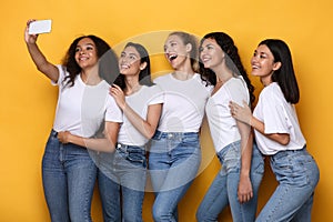 Happy Multiracial Ladies Making Selfie On Smartphone Over Yellow Background