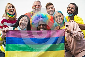 Happy Multiracial people celebrating gay pride festival during corona virus