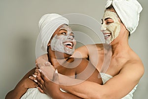 Happy multiracial women with different age and body size having skin care spa day