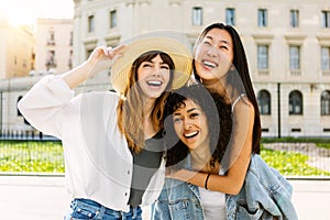 Happy multiracial young group of female friends having fun on summer vacation
