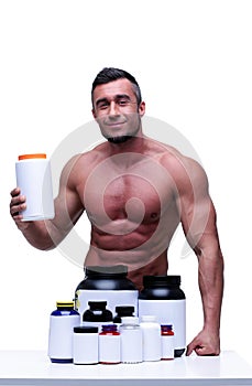happy muscular man with sports nutrtion