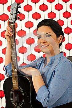 Happy musician woman with guitar