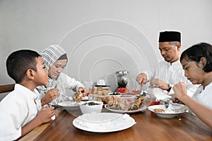 Muslim asian family having sahoor or sahur photo