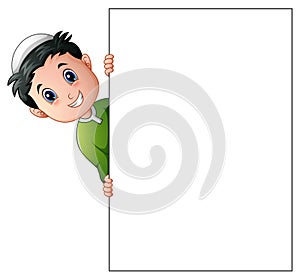 Happy muslim boy cartoon holding blank sign