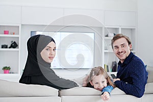 Happy Muslim family having fun at home