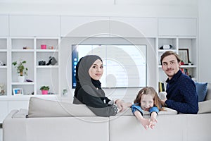 Happy Muslim family having fun at home