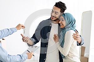 Happy muslim family relocating or buying house