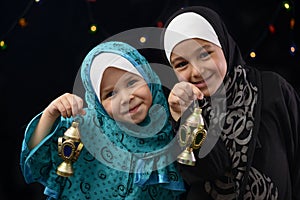 Happy Muslim Girls with Ramadan Lantern