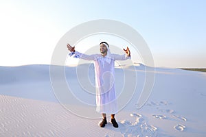 Happy Muslim man looks through banknotes and beside himself with