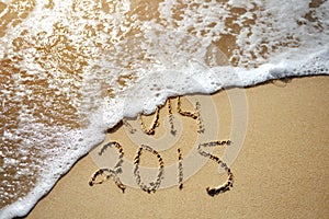 Happy Near Year concept 2015 replace 2014 on sea beach