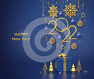 Happy New 2022 Year. Hanging golden metallic numbers 2022 with snowflakes, stars and balls on blue background. Gift box and golden