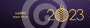 Happy New 2023 Year. Hanging Golden metallic numbers 2023 with shining 3D gold ball bauble and confetti on purple background. New