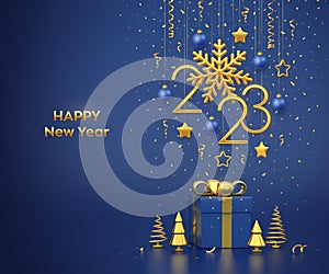 Happy New 2023 Year. Hanging golden metallic numbers 2023 with snowflake, stars and balls on blue background. Gift box and golden