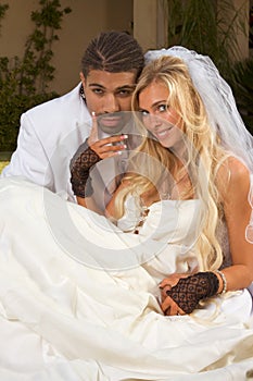 Happy new wed interracial couple in wedding mood