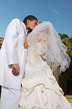 Happy new wed interracial couple in wedding mood