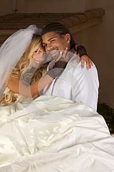 Happy new wed interracial couple in wedding mood photo