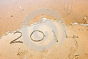 Happy New Year, 2014 written in sand