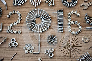 Happy new year 2016 composition with screws nails bolts and dowels