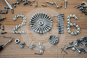 Happy new year 2016 composition with screws, nails bolts and dowels