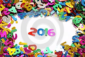 Happy new year 2016 from sparkles colorful glitters numbers on white background and around other numbers