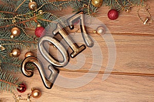 Happy new year 2017 gold figures on the wooden background