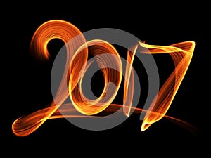 Happy new year 2017 isolated numbers lettering written with fire flame or smoke on black background