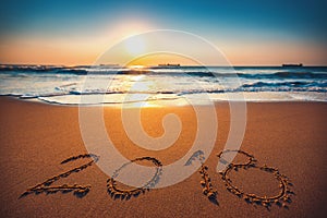 Happy New Year 2018 concept, lettering on the beach. Sea sunrise