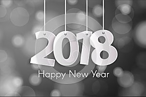 Happy New Year 2018 greeting card concept with paper cuted white numbers on ropes