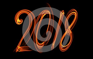 Happy new year 2018 isolated numbers lettering written with fire flame or smoke on black background